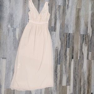 Maxi dress featuring a plunging halter neckline with a self-tie closure.